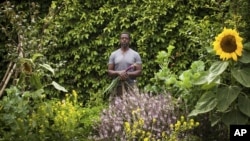 This photo provided by Stephen Zeigler shows Ron Finley in a garden in Los Angeles. Interest in gardening has grown around the country. Urban gardeners say it's particularly important for the health and resiliency of city neighborhoods. (Stephen Ziegler via AP)