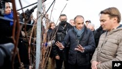 FILE - Eric Zemmour, far right candidate for the French presidential election 2022 visits a vineyard and meets local supporters in Husseren-les-chateaux, eastern France, Dec. 18, 2021.