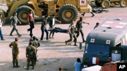 FILE - This Sunday, Oct. 23, 1983, file photo, shows the scene at the U.S. Marine base near Beirut airport, Lebanon, following a suicide truck blast that destroyed the base and caused a huge death toll.