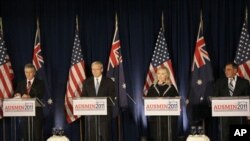 From left, Australian Defense Minister Stephen Smith, Australian Foreign Minister Kevin Rudd, Secretary of State Hillary Clinton, and U.S. Defense Secretary Leon Panetta speak at a news conference at AUSMIN 2011 in San Francisco, Thursday, Sept. 15, 2011.