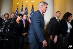 FILE - House Majority Leader Kevin McCarthy of California leaves a news conference after dropping out of the race to replace House Speaker John Boehner, on Capitol Hill in Washington, Oct. 8, 2015.