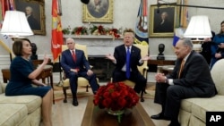 President Donald Trump and Vice President Mike Pence meet with Senate Minority Leader Chuck Schumer, D-N.Y., and House Minority Leader Nancy Pelosi, D-Calif., in the Oval Office of the White House, Tuesday, Dec. 11, 2018, in Washington. 