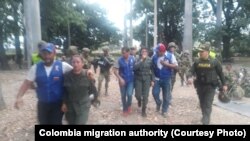The Colombian migration authority provided photos Feb. 23, 2019, of some of the 23 Venezuelan uniformed personnel, including 20 soldiers, who crossed into Colombia and surrendered.