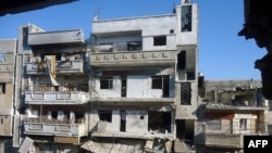 A handout picture released by the Syrian opposition's Shaam News Network on July 13, 2012 shows destruction in Homs Karm Shamsham neighbourhood on July 12, 2012. (AFP/Shaam News Network)