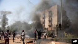 Protestors take to the streets of Burkina Faso's capital Ouagadougou on Nov. 27, 2021, calling for President Roch Marc Christian Kabore to resign.