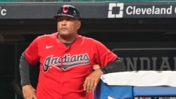 Cleveland Indians' Sandy Alomar Jr. waits to walk on the field during a baseball game against the Kansas City Royals, Sept. 21, 2021, in Cleveland.