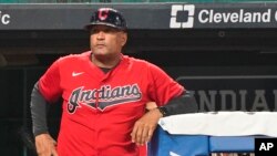Cleveland Indians' Sandy Alomar Jr. waits to walk on the field during a baseball game against the Kansas City Royals, Sept. 21, 2021, in Cleveland.