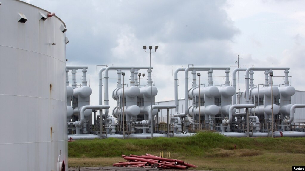 FILE - An oil storage tank and crude oil pipeline equipment is seen at the Strategic Petroleum Reserve in Freeport, Texas, U.S., June 9, 2016.