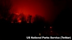 A fire burns at Great Smoky Mountains National Park in this photo tweeted by the National Parks Service, Nov. 29, 2016. Officials closed all facilities due to extensive fire activity and downed trees.