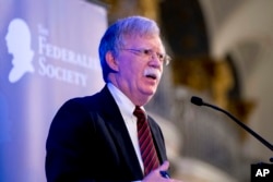 FILE - National Security Adviser John Bolton speaks at a Federalist Society luncheon at the Mayflower Hotel in Washington, Sept. 10, 2018.