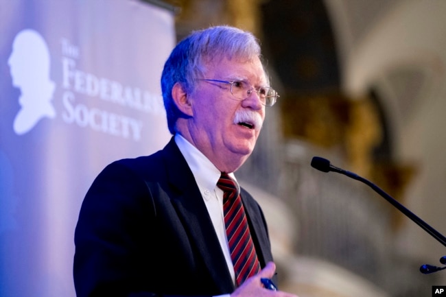 FILE - National Security Adviser John Bolton speaks at a Federalist Society luncheon at the Mayflower Hotel in Washington, Sept. 10, 2018.