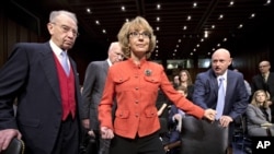 Former Arizona Rep. Gabrielle Giffords was seriously injured in the mass shooting that killed six people in Tucson, Arizona. She arrives on Capitol Hill in Washington for a hearing on gun laws.