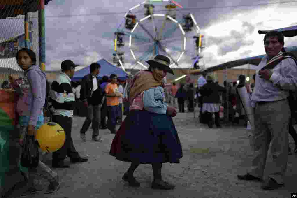 An indigenous woman walks at Canaan fair, which is part of Holy Week events in Ayacucho, Peru, March 28, 2013.