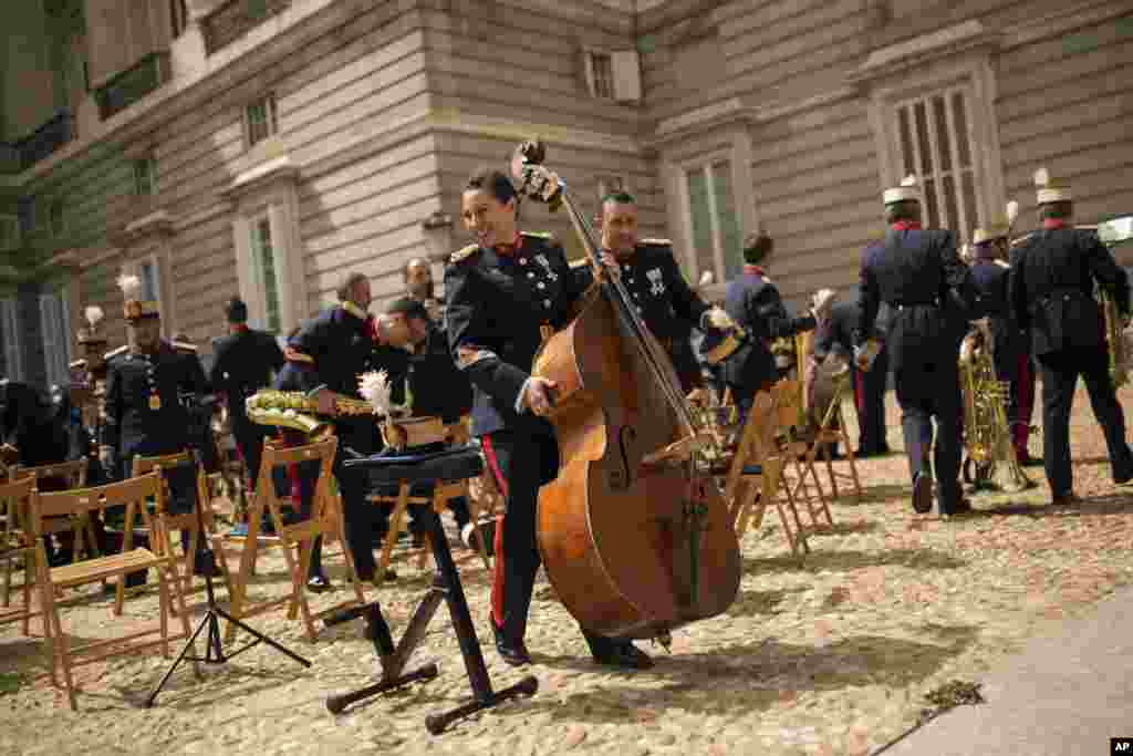 A member of the Royal Guard music band holds a double bass after playing outside the Royal Palace in Madrid, Spain.