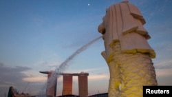 FILE - The Merlion statue overlooking the Marina Bay area. All of the suspected terrorists -- one of them 15 years old -- were from the main island of Java.