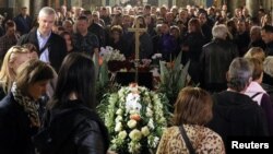 People attend the funeral service of killed Bulgarian journalist Viktoria Marinova in Sveta Troitsa (Holy Trinity) Cathedral in Ruse, Bulgaria, Oct. 12, 2018.