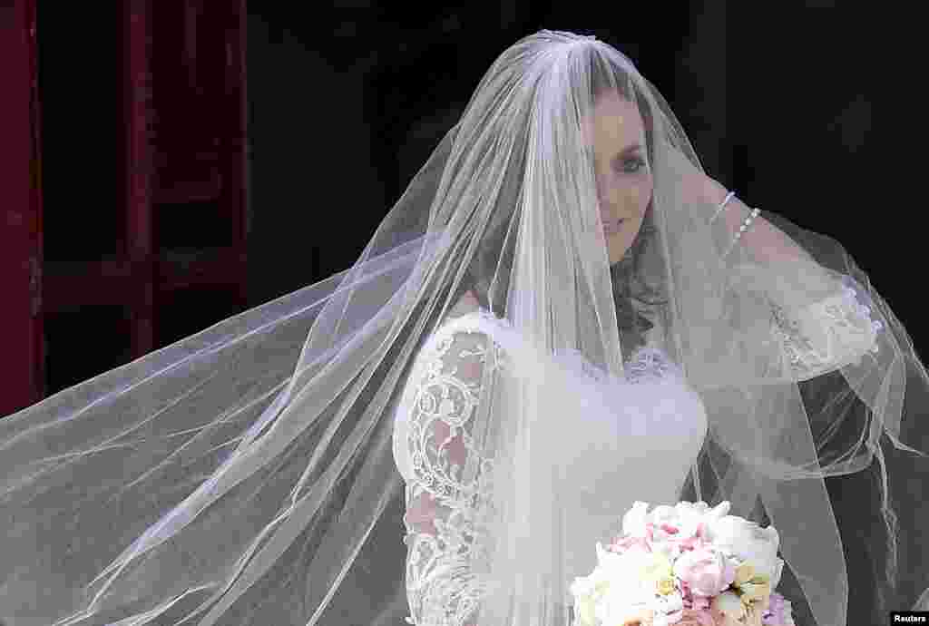 British singer and former member of the band Spice Girls Geri Halliwell arrives for her wedding with Formula One motor racing business owner Christian Horner at St. Mary's Church at Woburn in southern England.