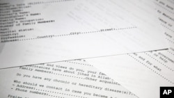 FILE - A translated copy of an application to join Osama bin Laden's terrorist network is seen on display in Washington, D.C., May 20, 2015. The document was among 100 released by U.S. intelligence officials.