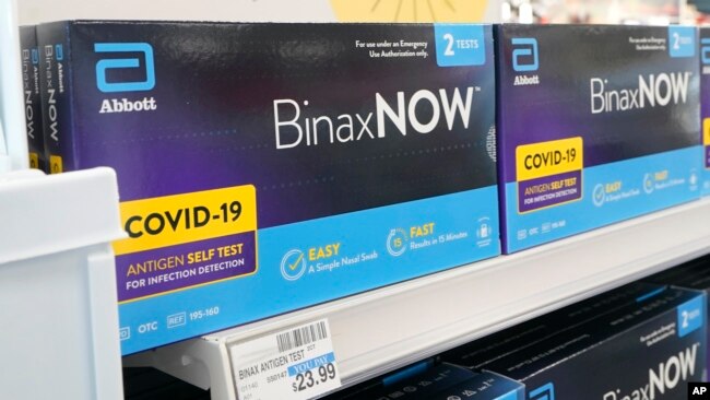 Boxes of BinaxNow home COVID-19 tests made by Abbott are shown for sale on Nov. 15, 2021, at a CVS store in Lakewood, Wash., south of Seattle.