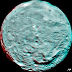This anaglyph image of the south polar region of the asteroid Vesta was put together from two clear filter images taken on July 9, 2011 by NASA's Dawn spacecraft. The image shows the rough topography in the south polar area, the large mountain, impact cra