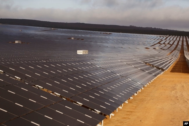 FILE - A photovoltaic solar park situated on the outskirts of the coastal town of Lamberts Bay, South Africa on March. 29, 2016. (AP Photo/Schalk van Zuydam)