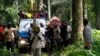 Relatives and friends carry the body of Yvonne Masika, who was killed during an attack by suspected ADF-NALU rebels, for burial in Mbau village near Beni, in North Kivu province, DRC, Oct. 21, 2014.