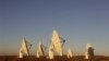 Radio telescopes like these near Carnarvon, South Africa are used to study radio signals from throughout the universe.