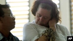 Lindsay Sandiford stands next to her interpreter as her verdict is announced at a courthouse in Bali on Tuesday, Jan. 22, 2013. 