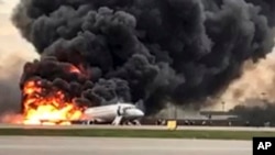 This image taken from a video distributed by Russian Investigative Committee on Sunday, May 5, 2019, shows the Sukhoi SSJ100 aircraft of Aeroflot Airlines on fire, at Sheremetyevo airport, outside Moscow, Russia. 