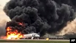 This image taken from a video distributed by Russian Investigative Committee on Sunday, May 5, 2019, shows the Sukhoi SSJ100 aircraft of Aeroflot Airlines on fire, at Sheremetyevo airport, outside Moscow, Russia. 