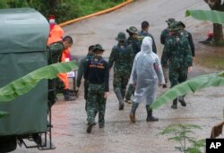 Rescuers move to the entrance to a cave complex where five stil lwere trapped in Mae Sai, Chiang Rai province, northern Thailand, July 10, 2018.
