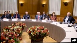 Leaders gather at the United Nations Palais, Sunday, Nov. 24, 2013, in Geneva, Switzerland, during the Iran nuclear talks.