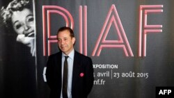 Director of the Bibliotheque Nationale de France (BNF, the National Library of France), Bruno Racine, poses during the opening of the exhibition "Piaf," dedicated to France's legendary singer Edith Piaf, April 14, 2015, at the BNF in Paris. 
