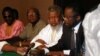 Sierra Leone's rebel leader Foday Sankoh (2nd R) is flanked by senior aides at the formal opening in Lome, Togo of talks with his guerrilla field commanders and United Nations officials on ending Sierra Leone's civil war. Others (from left) are Sankoh's m