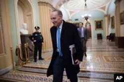 Senate Minority Leader Chuck Schumer, D-N.Y., arrives at the Capitol at the start of the third day of the government shutdown, in Washington, Jan. 22, 2018.