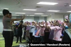Queenrides women members take part in a workshop in Indonesia.