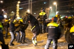 Dutch riot police battle pro-Erdogan demonstrators after riots broke out at the Turkish consulate in Rotterdam, Netherlands, March 12, 2017.