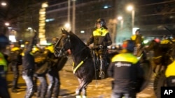 Dutch riot police battle pro Erdogan demonstrators after riots broke out at the Turkish consulate in Rotterdam, Netherlands, March 12, 2017.