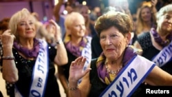 Holocaust survivor Carmela Ben Yehuda, 89, dances during the annual Holocaust survivors' beauty pageant in the Israeli city of Haifa, Oct. 30, 2016.