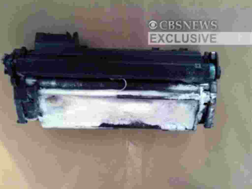This image provided by CBS News shows a printer toner cartridge with wires and powder found in a package aboard a plane searched in East Midlands, north of London, 29 Oct 2010