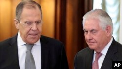 FILE - US Secretary of State Rex Tillerson,right, and Russian Foreign Minister Sergey Lavrov, enter a hall prior to their talks in Moscow, Russia, April 12, 2017. 
