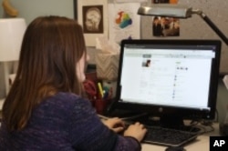 ResearchGate fan Caroline Moore-Kochlacs logs onto the website at her Boston University office.