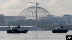 Patrol boats of the Philippine Navy Special Operations Group are positioned near the venue as they implement a no-sail zone policy at the restricted zone for next week's APEC (Asia-Pacific Economic Cooperation) Summit of Leaders Friday, Nov. 13, 2015.
