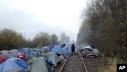 FILE - A migrants makeshift camp is set up in Calais, northern France, on Nov. 27, 2021.