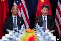 FILE - President Barack Obama, left, meets with Chinese President Xi Jinping, March 31, 2016.