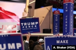 Delegates wave signs and flags during the final day of the Republican National Convention in Cleveland, July 21, 2016.