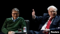 American billionaires Warren Buffett and Bill Gates appear together at Columbia University in New York, Jan. 27, 2017.