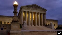 FILE - The U. S. Supreme Court building stands quietly before dawn in Washington, Oct. 5, 2018. 