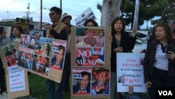 A crowd of Cambodian Americans rally against the visit of Lt. Gen. Hun Manet, Deputy Chairman of Joint Staff in the Royal Cambodian Armed Forces, and the eldest son of Prime Minister Hun Sen, in Long Beach, California, April 9, 2016.