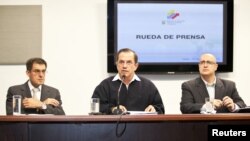 Ecuador's Minister of Foreign Affairs Ricardo Patino (C), attends a news conference regarding WikiLeaks' founder Julian Assange in Quito June 19, 2012.